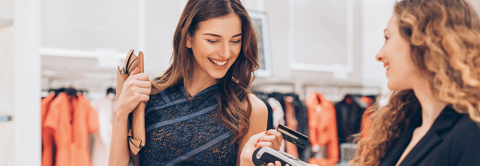 Woman paying with card in store